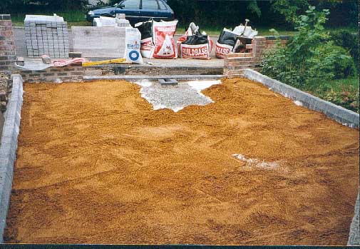 Spreading the sand.
